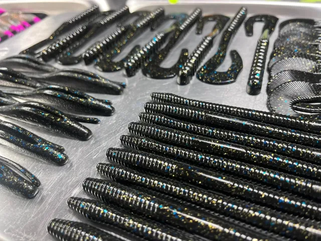 Dark worms and flat-tail soft plastics in rows